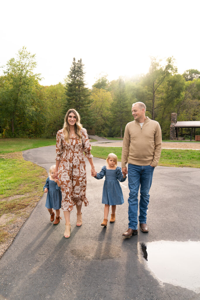A family of four walks together during their family pictures.